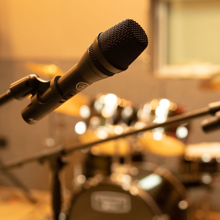 Acoustic guitars and seating in a practice room